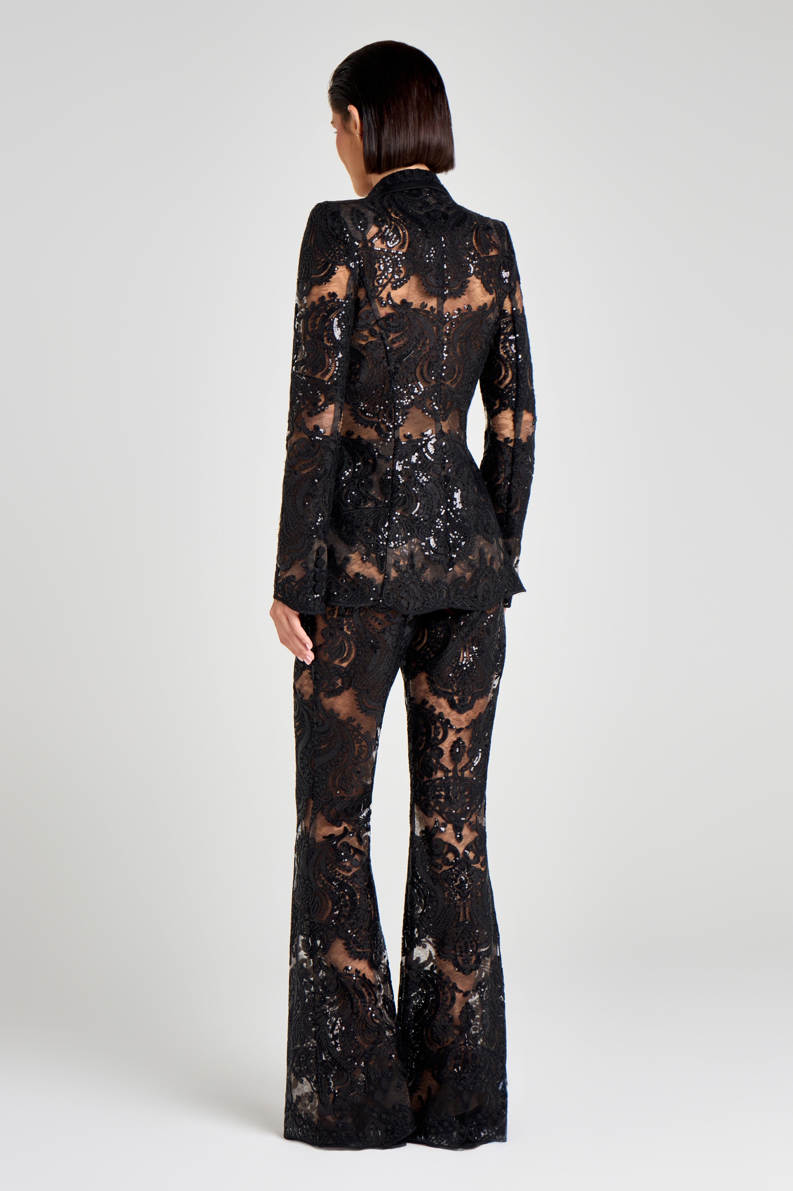 Black lace suit on a white background