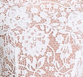 Close-up of a lace fabric with a floral pattern
