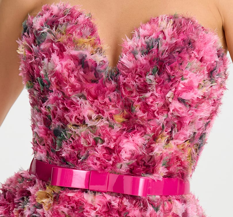 Pink textured dress with a belt on a white background